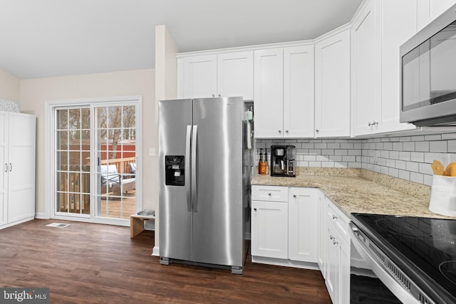 kitchen with white cabinets, dark hardwood / wood-style flooring, and stainless steel appliances