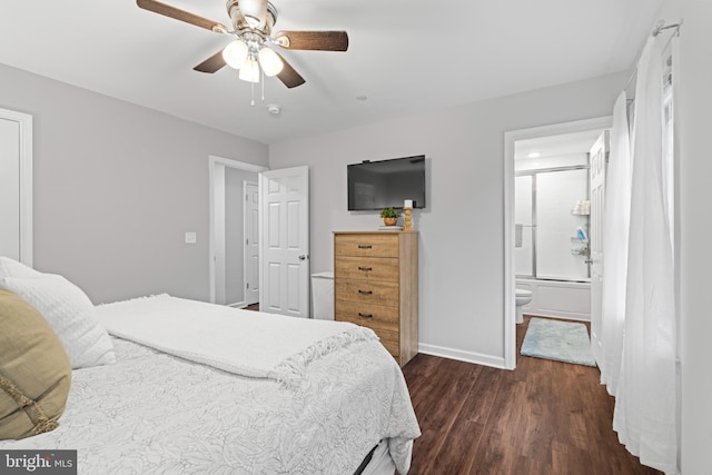 bedroom with ceiling fan, dark wood-type flooring, and connected bathroom