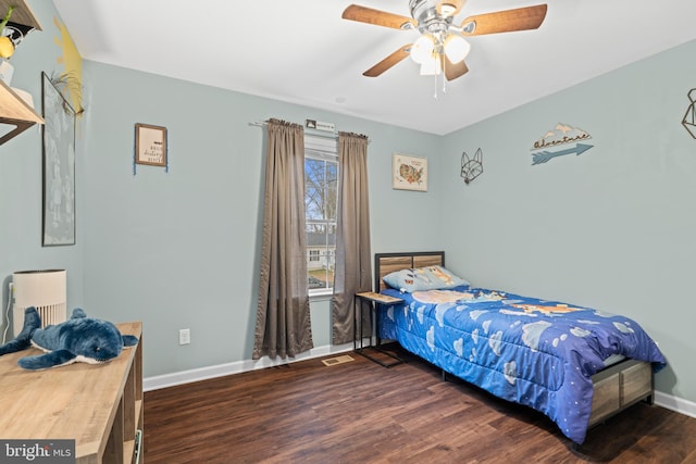 bedroom featuring ceiling fan and dark wood-type flooring