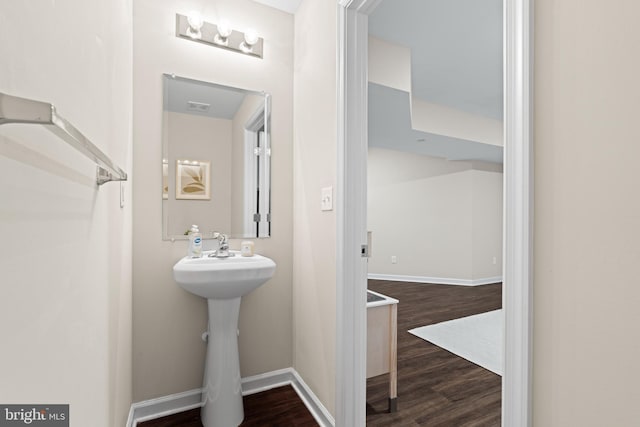 bathroom with wood-type flooring