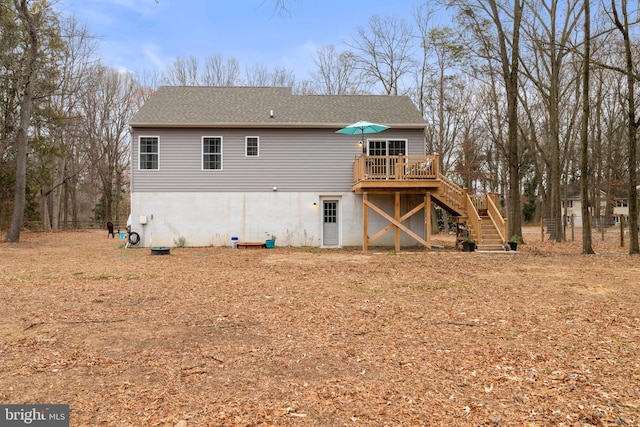 rear view of house with a wooden deck