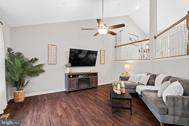 living room featuring dark hardwood / wood-style flooring, high vaulted ceiling, and ceiling fan