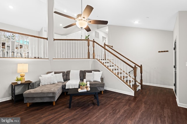 living room with ceiling fan, dark hardwood / wood-style flooring, and lofted ceiling