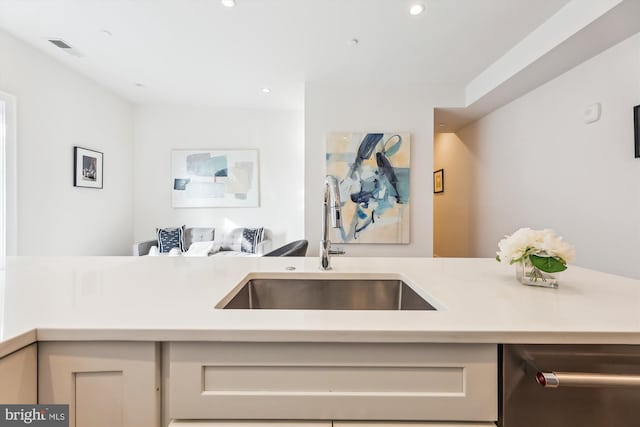 kitchen with sink and stainless steel dishwasher