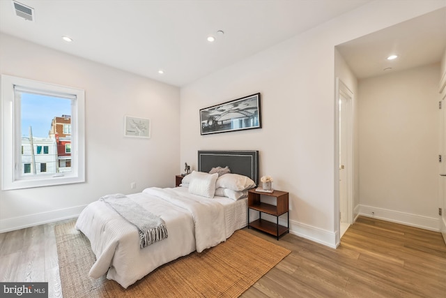 bedroom with light hardwood / wood-style floors