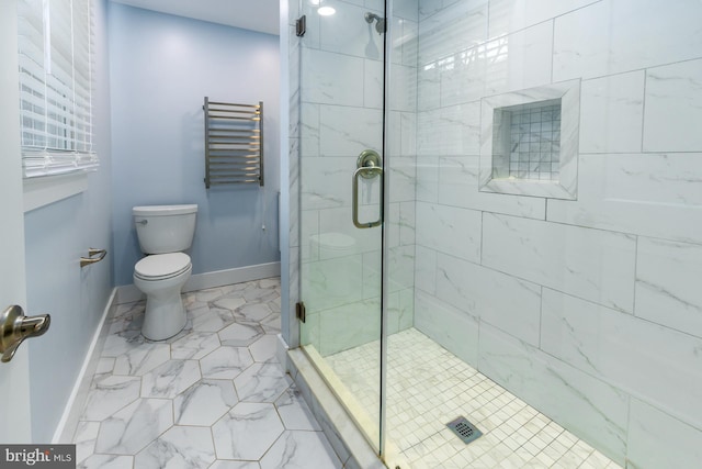 bathroom featuring toilet, radiator, and a shower with shower door