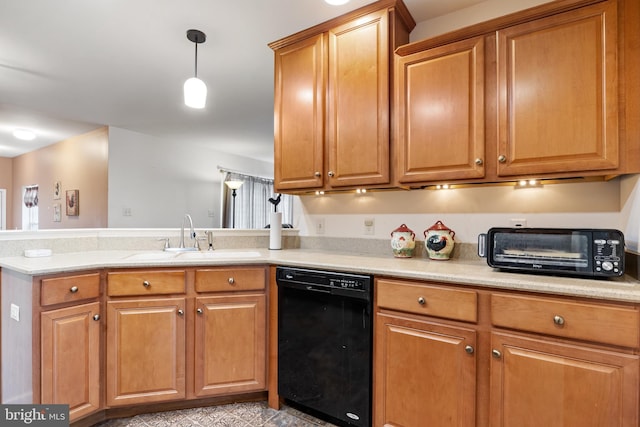 kitchen with black dishwasher, light countertops, a sink, and a peninsula