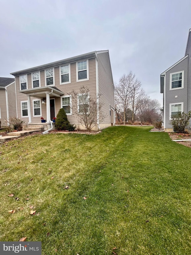 view of front of home featuring a front lawn