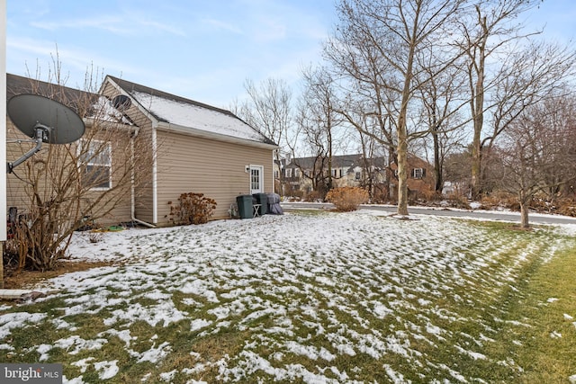 view of yard covered in snow