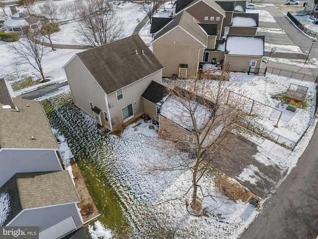 snowy aerial view featuring a residential view