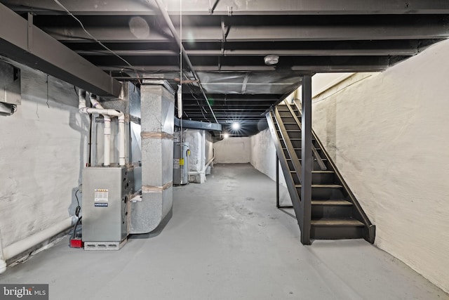 basement featuring heating unit and gas water heater