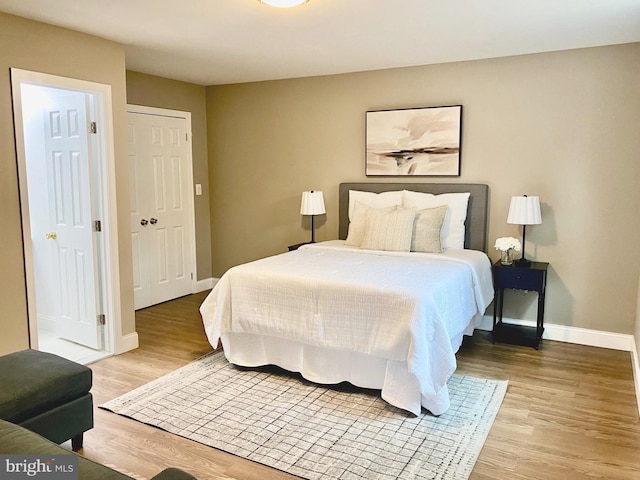 bedroom featuring a closet and hardwood / wood-style flooring