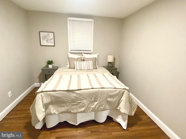 bedroom featuring dark wood-type flooring