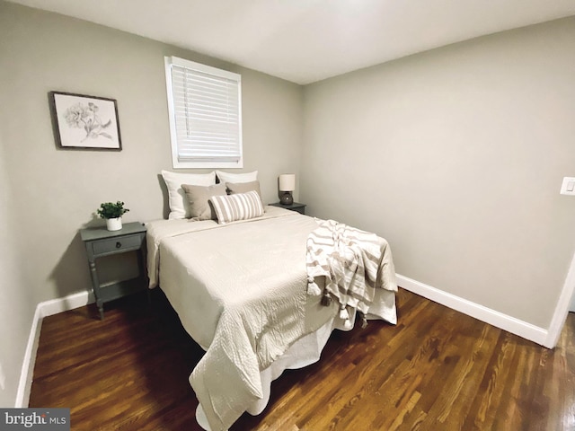 bedroom featuring dark hardwood / wood-style flooring