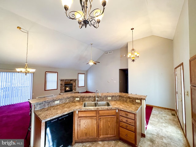 kitchen with dishwasher, ceiling fan with notable chandelier, sink, vaulted ceiling, and plenty of natural light