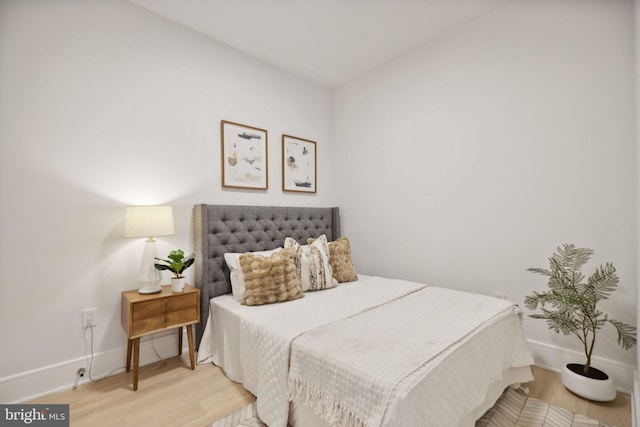 bedroom featuring wood-type flooring