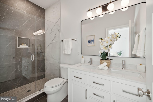 bathroom featuring walk in shower, tile patterned flooring, vanity, and toilet