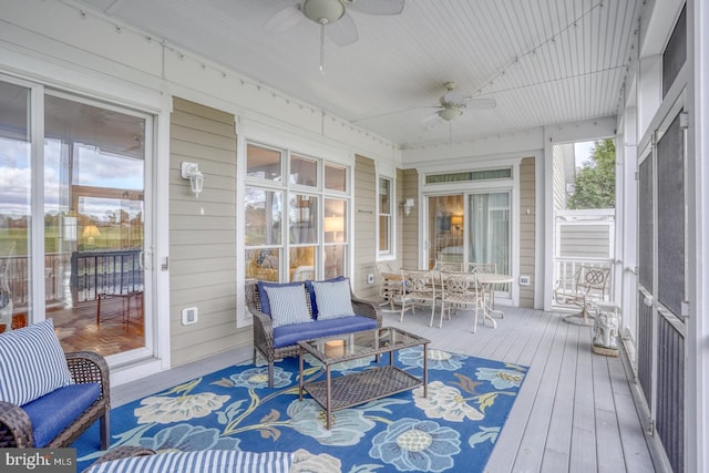 sunroom / solarium with ceiling fan