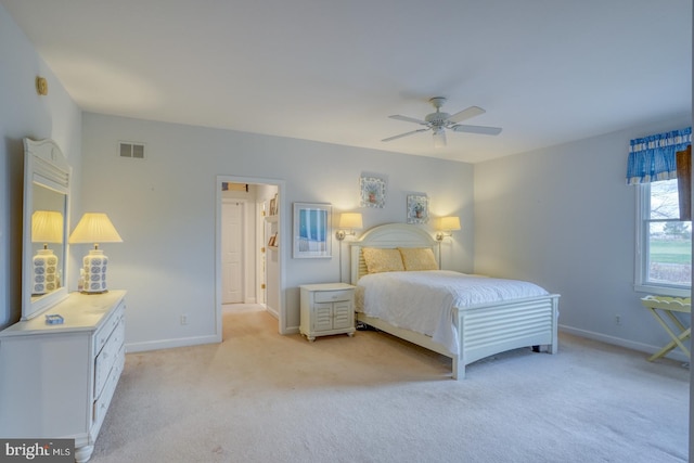 bedroom with light carpet and ceiling fan