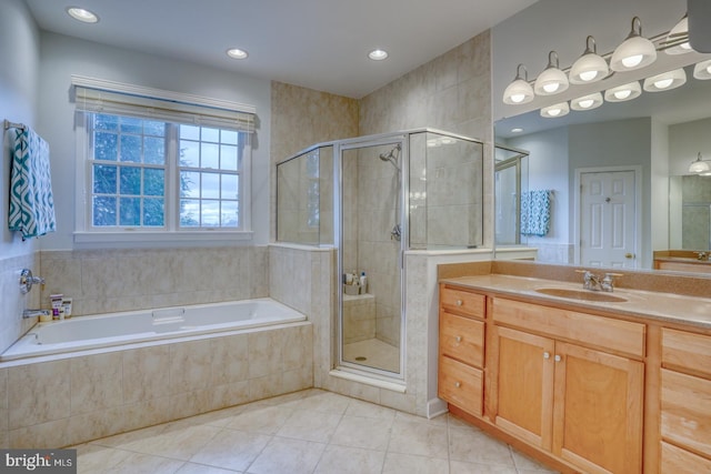 bathroom with tile patterned flooring, vanity, and plus walk in shower