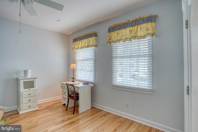 office space with ceiling fan and light hardwood / wood-style flooring