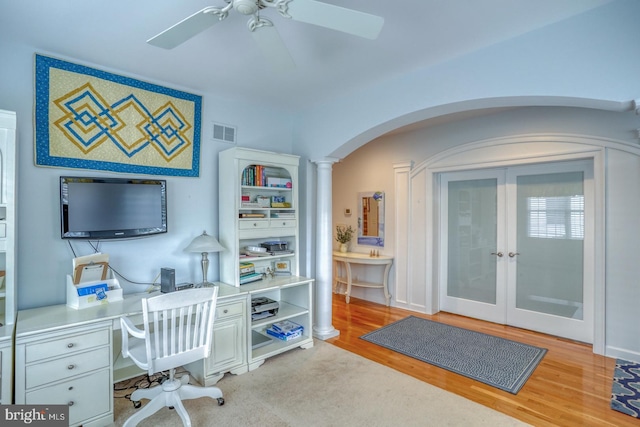 office area with ceiling fan, light hardwood / wood-style floors, ornate columns, and french doors