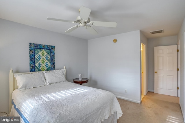 bedroom with light colored carpet and ceiling fan