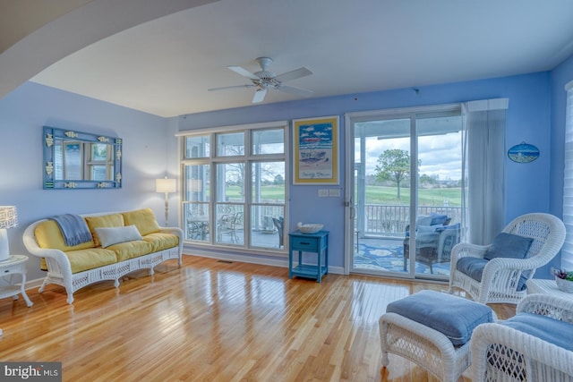 sitting room with ceiling fan and light hardwood / wood-style floors