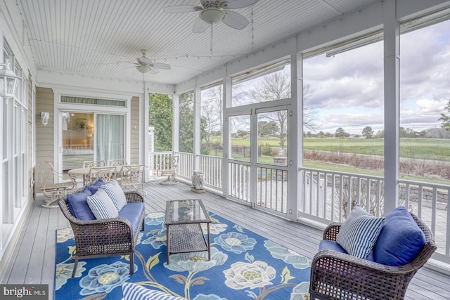 sunroom / solarium with ceiling fan