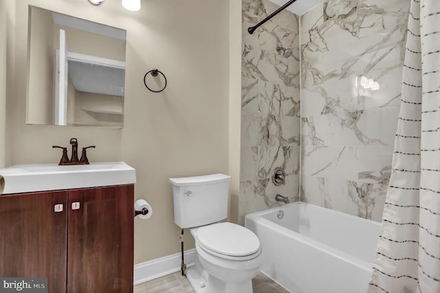 full bathroom with hardwood / wood-style flooring, shower / bath combo, toilet, and vanity