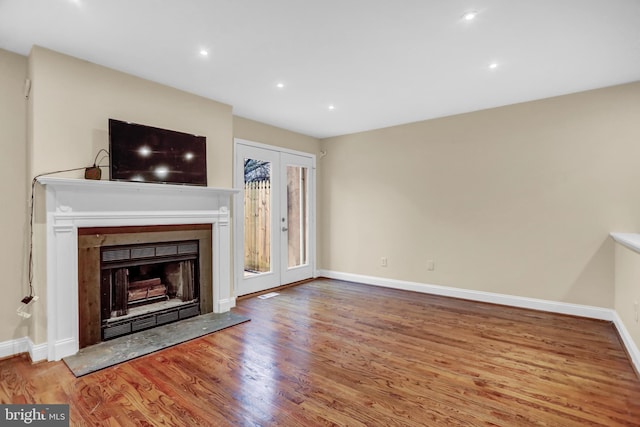 unfurnished living room featuring light hardwood / wood-style flooring