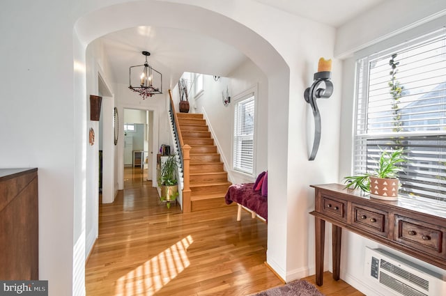 entrance foyer with a chandelier and light hardwood / wood-style floors