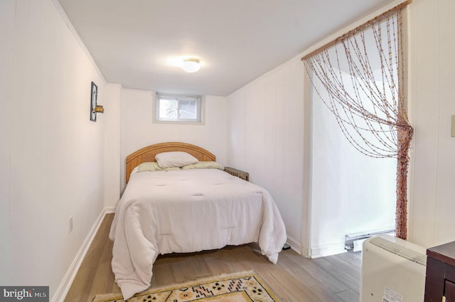 bedroom with light hardwood / wood-style floors