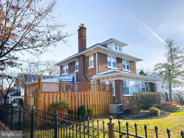 view of front of property with central air condition unit