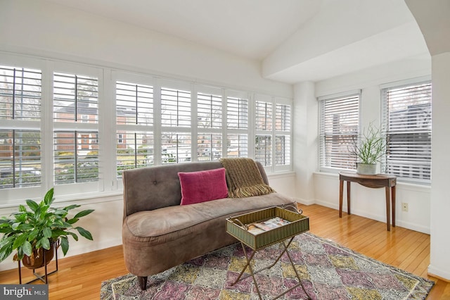 sitting room featuring light hardwood / wood-style flooring and lofted ceiling