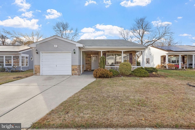 single story home featuring covered porch, a garage, and a front yard