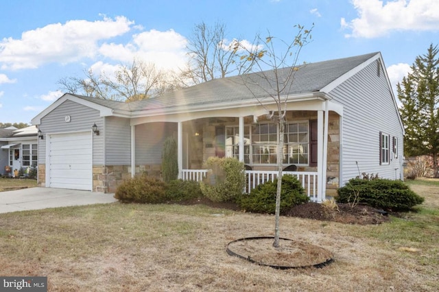 view of front of house with a front lawn, a porch, and a garage