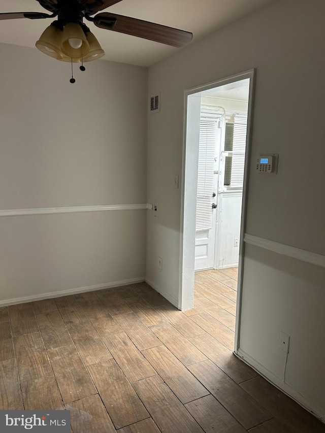 spare room with ceiling fan and light hardwood / wood-style floors