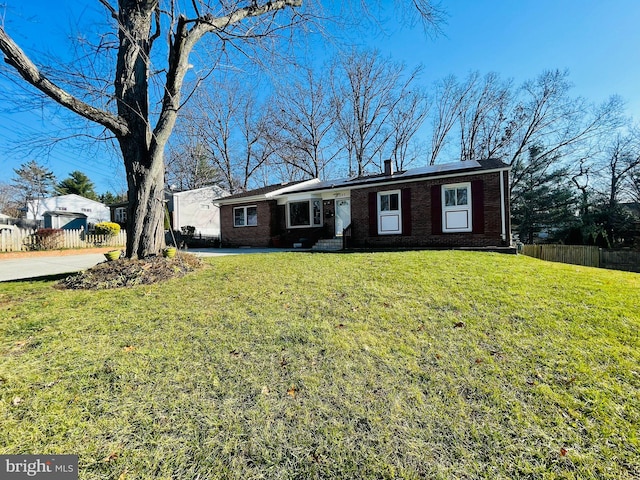 ranch-style home with a front lawn