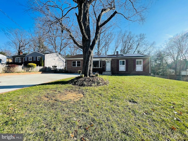 ranch-style house with a front yard