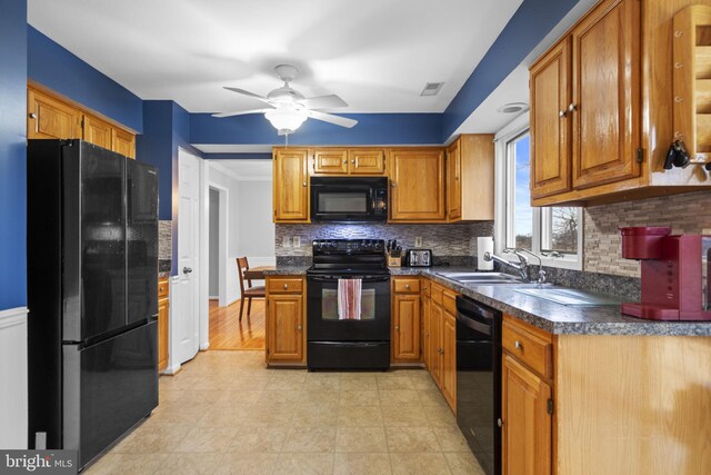 kitchen with sink, tasteful backsplash, ceiling fan, and black appliances