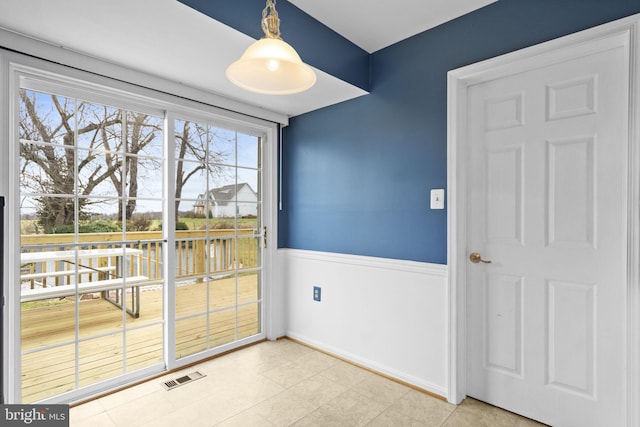 interior space with tile patterned floors and a healthy amount of sunlight