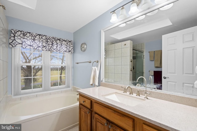 bathroom featuring vanity and plus walk in shower