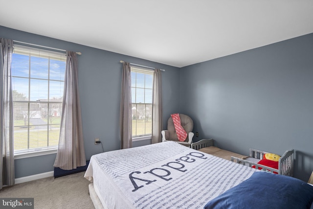 bedroom featuring light colored carpet