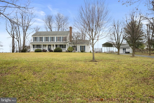 colonial inspired home with a front yard