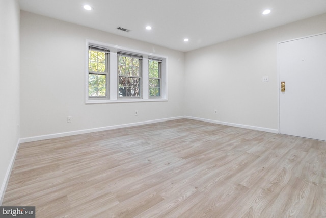 spare room featuring recessed lighting, visible vents, and light wood finished floors