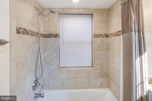 bathroom with shower / tub combo with curtain