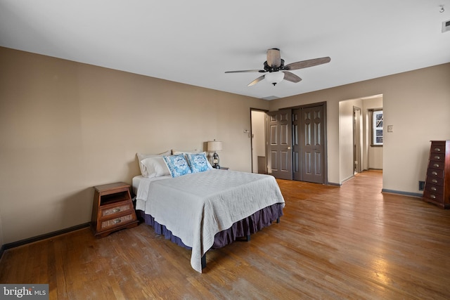 bedroom featuring ceiling fan and wood-type flooring