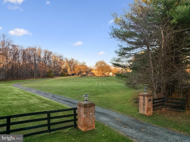 view of property's community with a lawn