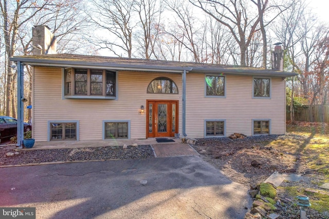 split foyer home featuring a patio